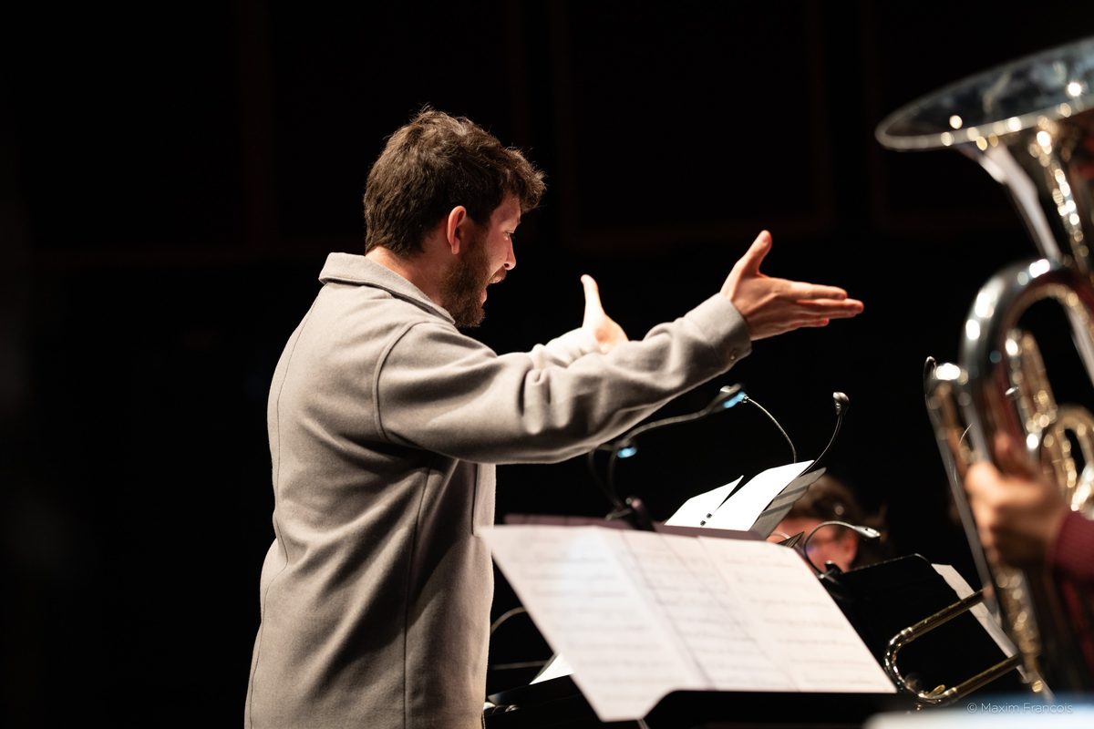 Gabriele di Franco conducting, arms open