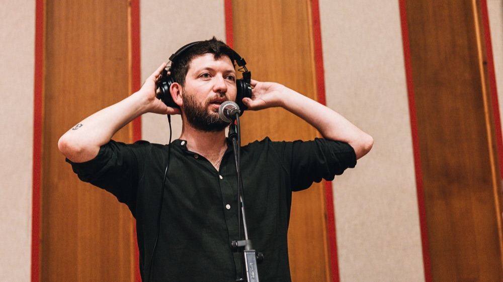 Gabriele di Franco with headphones in the studio
